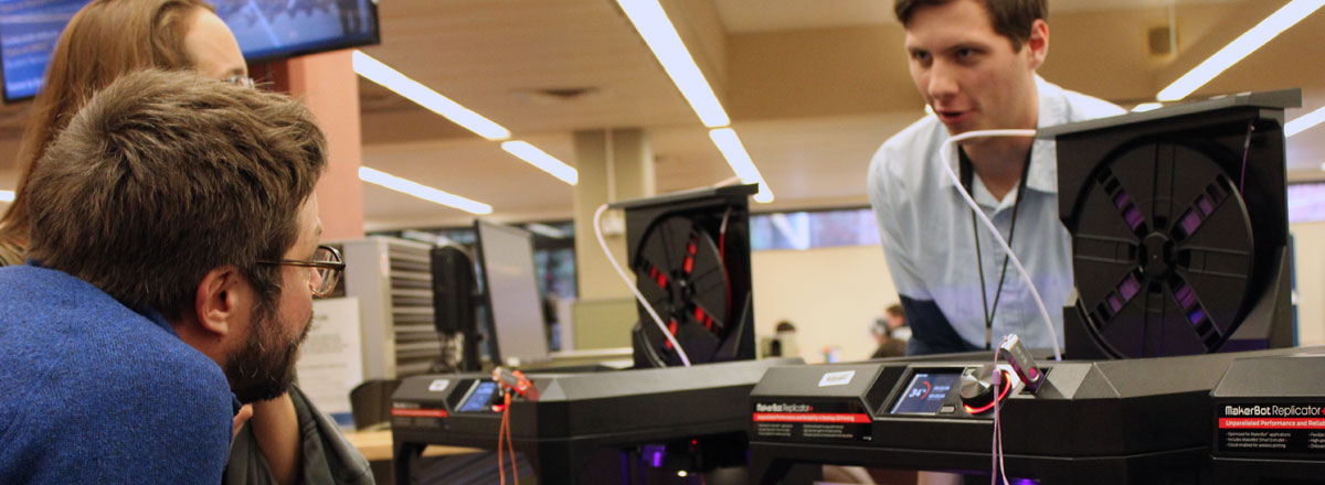 Instructor shows students how to use 3D printers