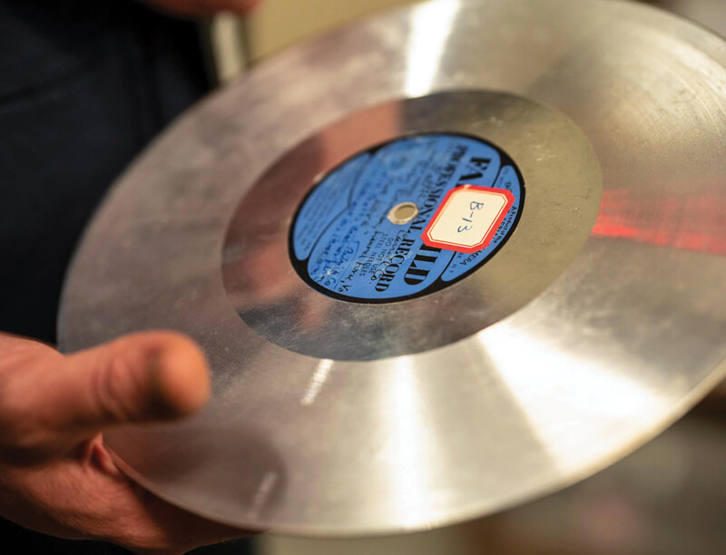 hands holding aluminum discs