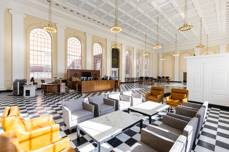 A bright room with chairs and an information desk