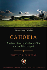 Book cover of Cahokia: Ancient America's Great City on the Mississippi by Timothy R. Pauketat. The cover features a landscape image of the Cahokia Mounds under a cloudy sky, with trees and grassy mounds in the background. The title and author's name are displayed in bold text, along with a quote reading 'Mesmerizing' from Salon. Part of The Penguin Library of American Indian History series.