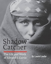 Cover of the book 'Shadow Catcher: The Life and Work of Edward S. Curtis' by Laurie Lawlor, featuring a close-up black and white portrait of an individual wrapped in a blanket.